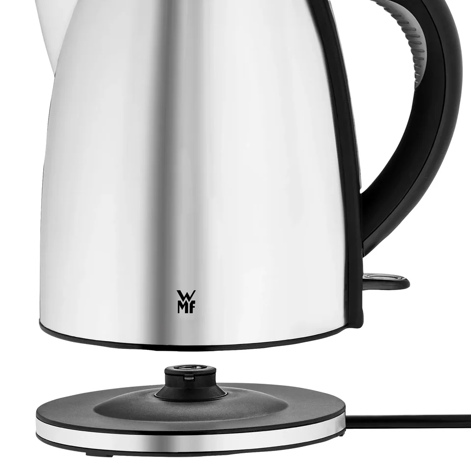 Close-up of the WMF Stelio kettle above its separate 360 degree base with mains cable; manufacturer illustration of removal